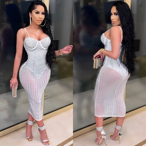 Detail of white mesh bodycon dress with vertical rhinestones and corset bodice