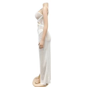 Detail view of white mesh evening dress with sparkling rhinestones and side cut-outs