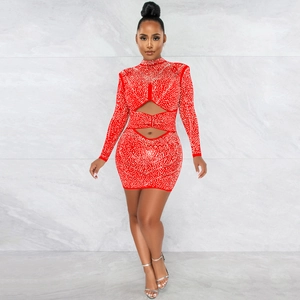 Close-up of red rhinestone mesh mini dress with elegant waist cut-outs and long sleeves