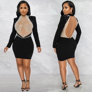 Sexy black bodycon mini dress with sheer mesh, pearls, and rhinestones, front and back view