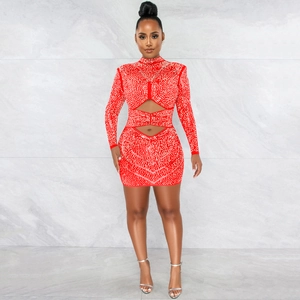 Detailed view of the sparkling rhinestones on this sexy red mesh cutout long sleeve dress