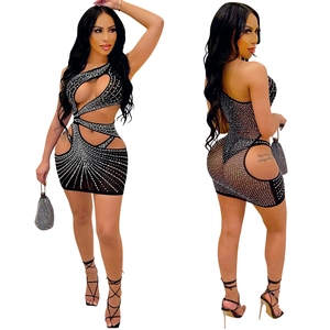 Detail of black rhinestone bodycon dress featuring sexy side cut-outs and shimmering mesh
