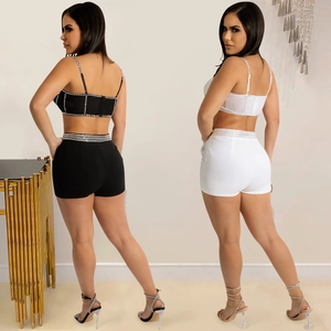 Two-piece set with rhinestone trim, crop top and slim fit shorts in black and white