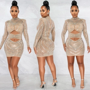 Detail view of the nude mini dress with sparkling rhinestones and side cut-outs