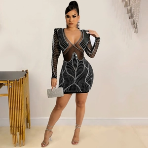 Close-up of mesh see-through panel and silver rhinestone patterns on the party dress
