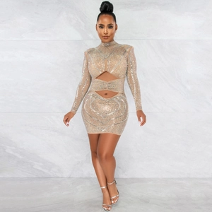 Detail of nude mesh dress featuring hollow-out waist and sparkling rhinestones
