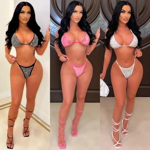 Close-up of sparkling rhinestone mesh bikini set in black, pink, and white options