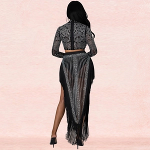 Detail view of the back zipper and fringe hem on this black rhinestone two-piece set