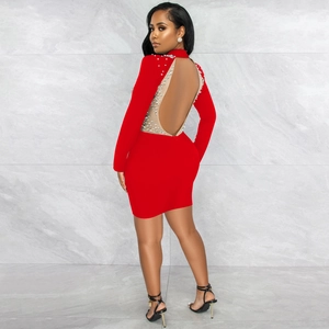 Detail view of the sexy backless red mini dress with pearls and mesh cutouts