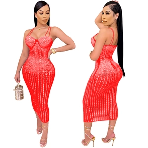 Detail view of red bodycon midi dress with vertical silver rhinestones and thin straps