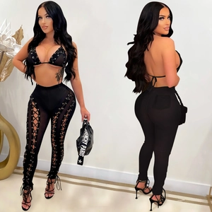 Sexy black two-piece mesh set with lace-up halter top and slim high-waisted trousers