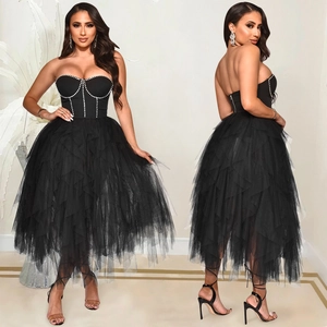 Elegant black strapless evening dress with pearl embellishments and fluffy mesh layers