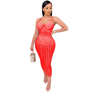 Detail of red bodycon dress featuring vertical silver rhinestones and thin straps