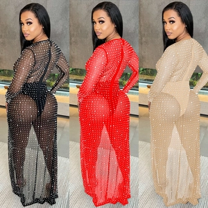 Detail showing sheer mesh long sleeve dresses with polka dots in black, red, and apricot colors
