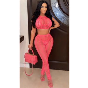 Close-up of hot pink rhinestone mesh fabric and breathable fishnet texture on suit