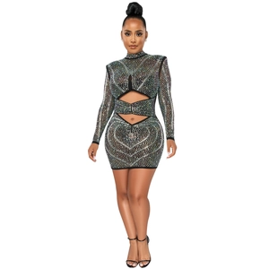 Close-up of black mesh mini dress with rhinestones and heart-shaped hollow-out patterns