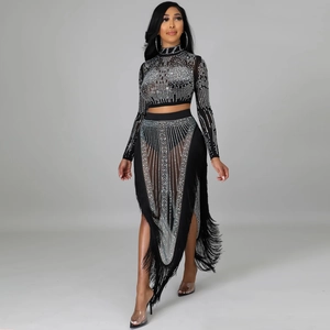 Detail of sheer black mesh two-piece set with sparkling rhinestones and long tassels