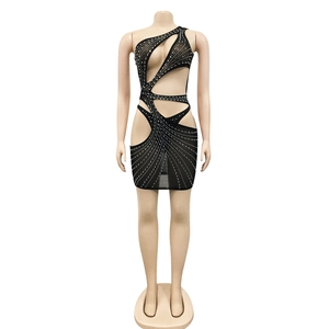 Close-up of black one-shoulder mesh dress with shimmering rhinestones and cut-outs