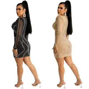 Sultry long sleeve mesh mini dress with shimmering rhinestones in black and beige