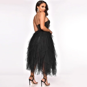 Side view of black strapless evening dress with tiered tulle skirt and rhinestone accents