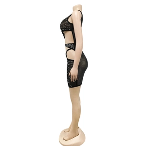 Detailed side view of black sheer mesh mini dress with rhinestones and side cutouts