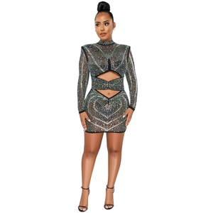 Detail of black mesh mini dress with rhinestones, cut-out design and long sleeves