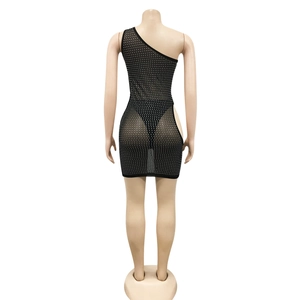 Detail of black one-shoulder mesh mini dress with shimmering silver rhinestone embellishments