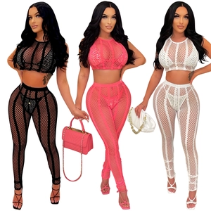 Close-up of three-piece mesh rhinestone set in black, hot pink, and white colors