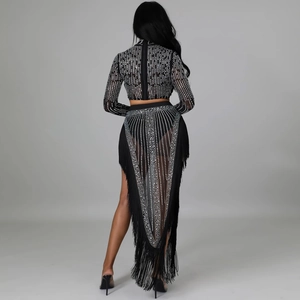 Macro detail of sexy black mesh two-piece set featuring silver rhinestones and long tassels