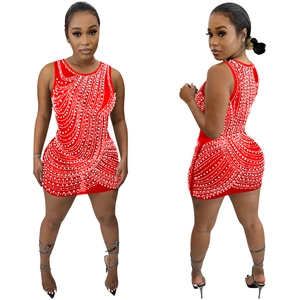 Close-up of red bodycon mini dress featuring intricate white pearl bead wavy patterns