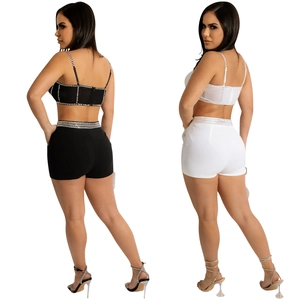 Women's two-piece set with rhinestone crop top and high-waisted shorts in black and white
