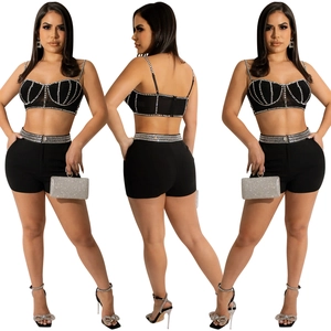 Detailed views of a black two-piece set featuring rhinestone accents on top and shorts