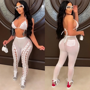 Sexy white two-piece mesh set with halter bikini top and sheer lace-up trousers