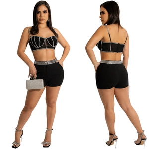 Detail of black two-piece set featuring rhinestone mesh tank top and high-waist shorts