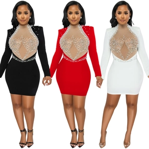 Detail view of sparkly mesh bodycon dress with pearls and rhinestones in black, red and white