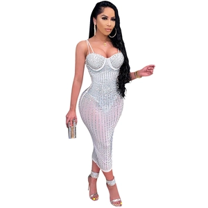Close-up of white mesh bodycon dress with sparkling silver rhinestones and corset top