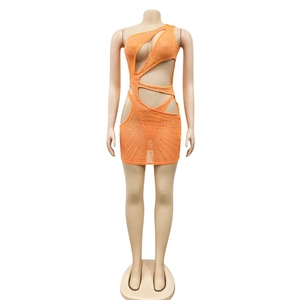 Detail of orange one-shoulder mini dress with cut-outs and radial silver rhinestones