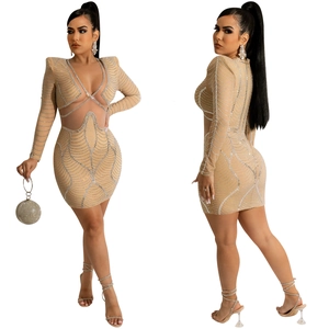Detail of sheer nude mesh mini dress with silver rhinestones and sexy cut-out waist design
