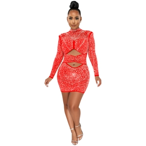 Detail of red rhinestone long sleeve mini dress featuring waist and chest cut-outs