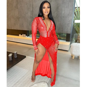 Detail of red sheer mesh maxi dress with rhinestones, plunging V-neck and high leg slit