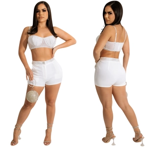 Front and back view of white camisole top and high waist shorts with rhinestone trim
