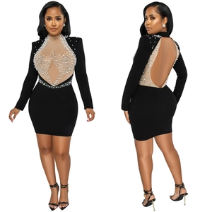 Detailed close-up showing backless design with white pearls and rhinestones on black mesh