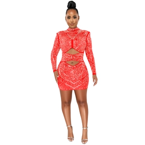Close-up of red bodycon dress with sparkling rhinestones and waist cut-out details