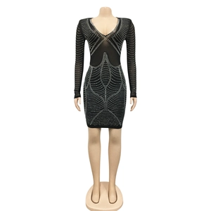 Detail of sexy deep V-neck long sleeve mesh dress with sparkling rhinestone geometric patterns
