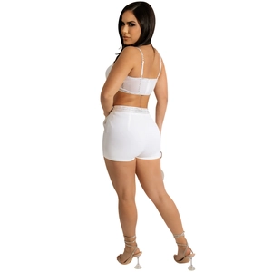 Rear view of white two-piece set featuring rhinestone-trimmed crop top and slim shorts