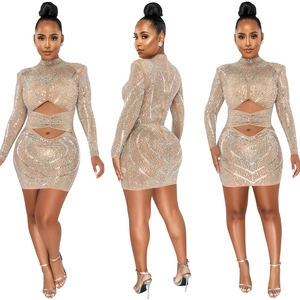 Detail of sheer rhinestone bodycon dress featuring waist cut-outs and mesh fabric