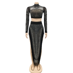 Detail of black mesh two-piece set with silver rhinestones and fringe hemline