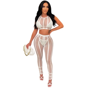 Detail view of white mesh rhinestone four-piece set with mesh vest and fitted trousers