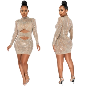 Detail showing sheer mesh fabric with silver rhinestones and stylish hollow-out cutouts