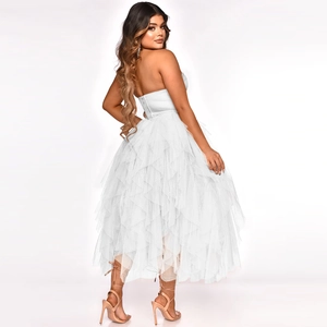 Detailed view of layered white tulle ruffles on an elegant strapless mesh dress